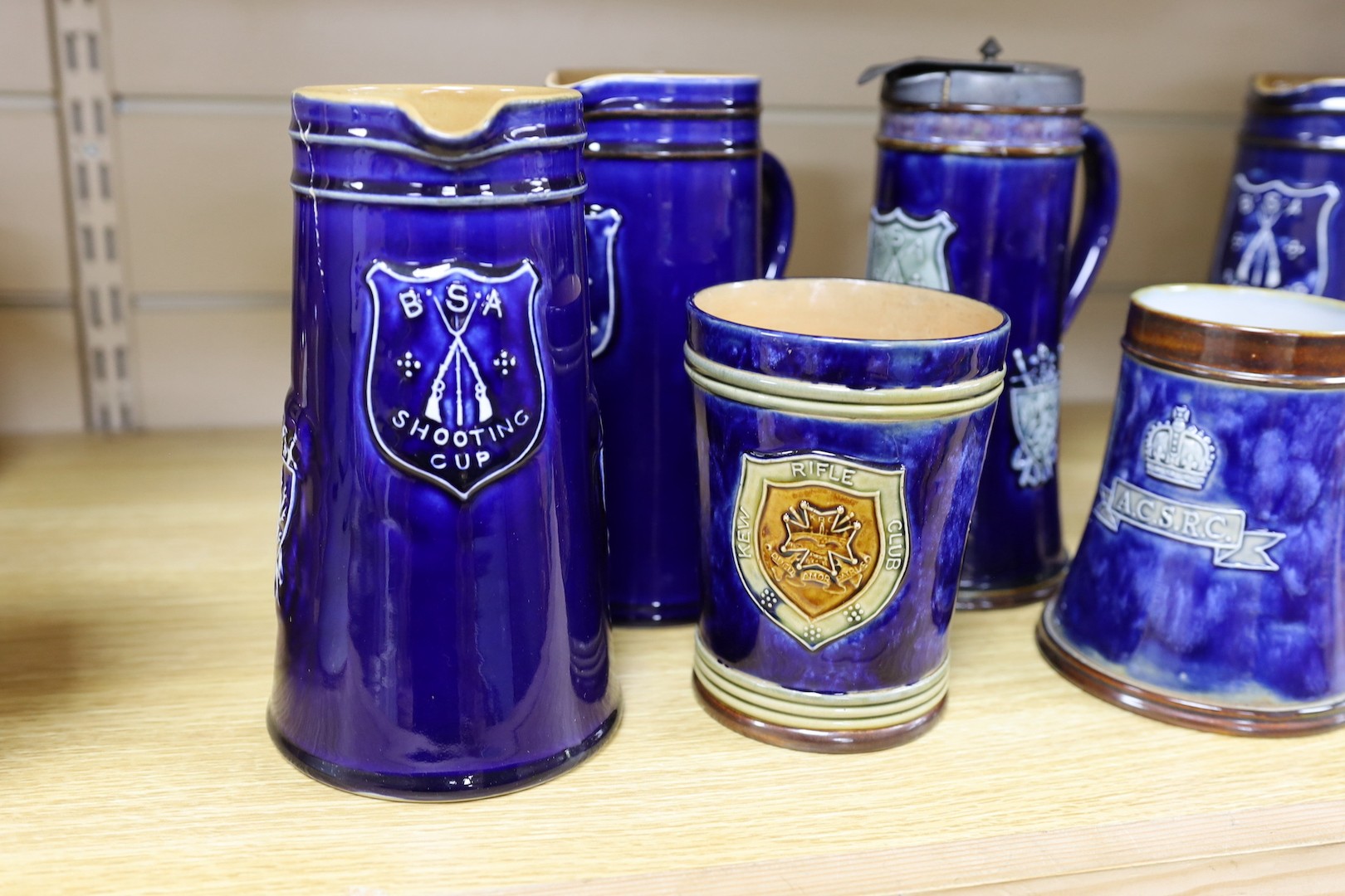 Four large Royal Doulton BSA Shooting Club jugs, 20cm, and two related mugs